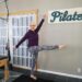 Be a leader, be you. Playful pose in front of Pilates sign